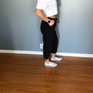 Womens black cropped drawstring pants.